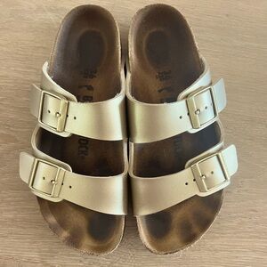 Gold Birkenstocks. Size 36 women’s European, lightly used.